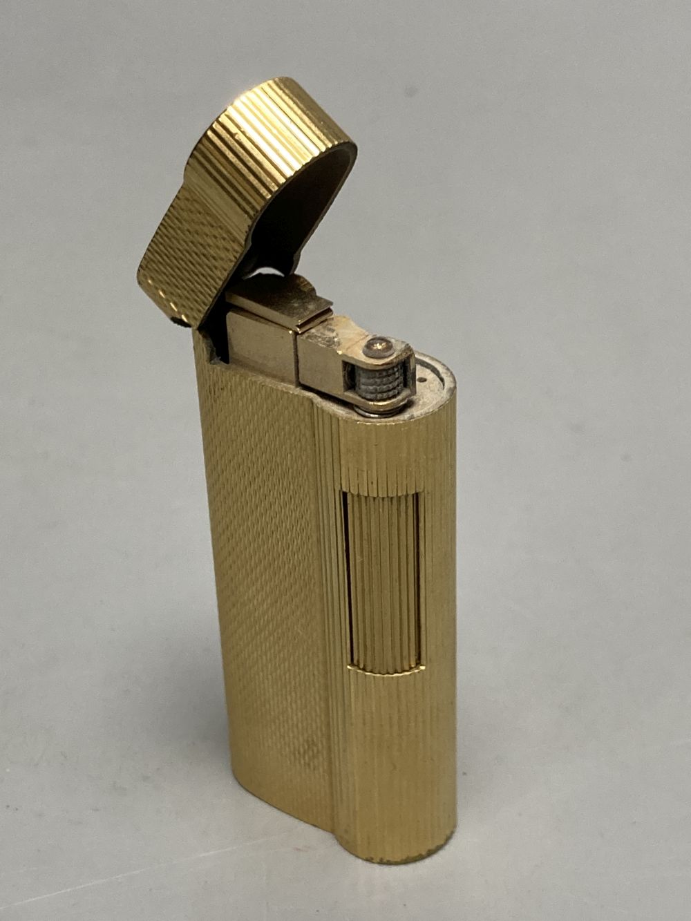 A gold plated Dunhill lighter no. A50077 and a German Dominus cigar cutter